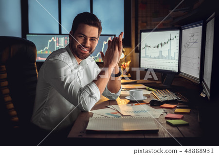 Young male trader at office work concept sitting successful leader Young male trader at office work concept sitting successful leader 48888931