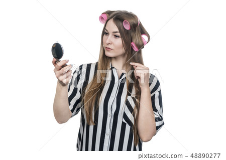 woman fixing her hair 48890277