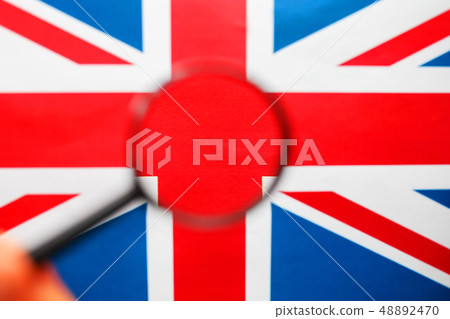 UK flag looking through a magnifying glass. The 48892470