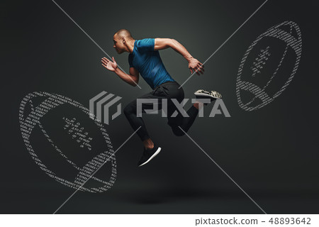 Improve yourself. Handsome sportsman is ready to run jumping over dark background. Graphic drawing 48893642