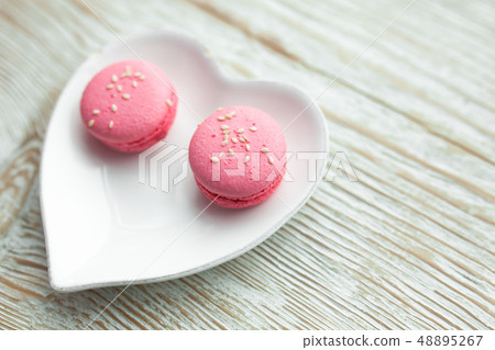 Delicious fresh macaroons on the plate Delicious fresh macaroons on the plate 48895267