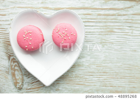 Delicious fresh macaroons on the plate Delicious fresh macaroons on the plate 48895268