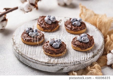 Easter cookies in shape of nest with eggs Easter cookies in shape of nest with eggs 48896835