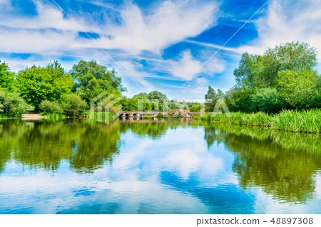 Calm landscape with blue river Calm landscape with blue river 48897308
