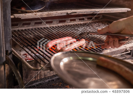 food, delicious and meat dishes concept - Horse sausages prepared on barbeque food, delicious and meat dishes concept - Horse sausages prepared on barbeque 48897806