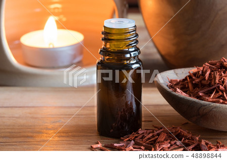 A bottle of sandalwood essential oil  48898844