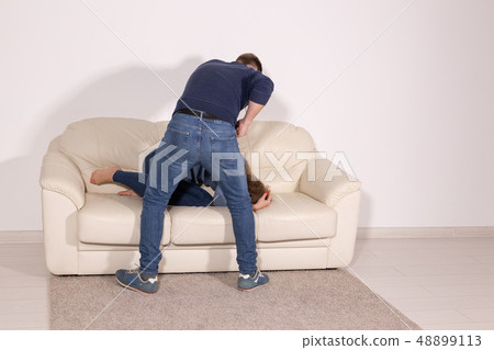 alcoholic, domestic violence and abuse concept - man gets drunk at home and takes his anger at his alcoholic, domestic violence and abuse concept - man gets drunk at home and takes his anger at his 48899113