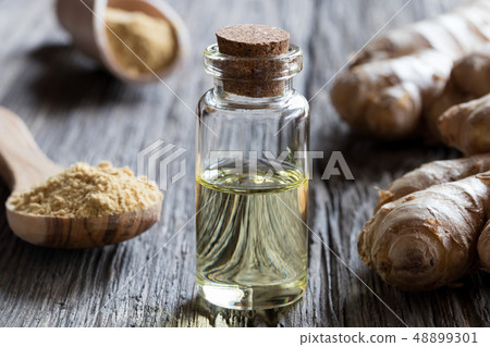 A bottle of ginger essential oil A bottle of ginger essential oil 48899301