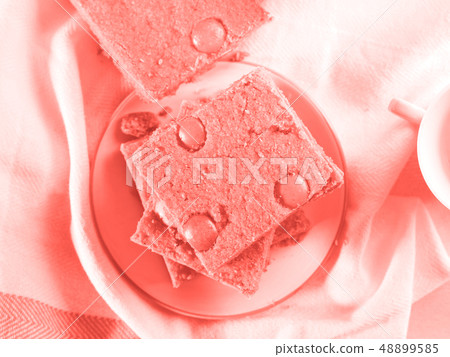 Blondies with candies for breakfast. Coral toned Blondies with candies for breakfast. Coral toned 48899585