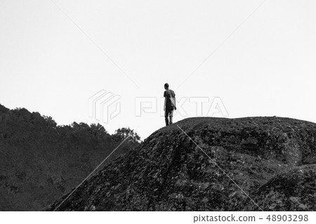 Man silhouette on rock at Meteora monastery Man silhouette on rock at Meteora monastery 48903298