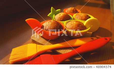 Simple mini muffins in colorful silicone bakeware. Kitchen and cooking concept 48904374