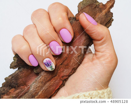 Fashionable lilac manicure design on your hand. Fashionable lilac manicure design on your hand. 48905128