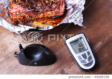Grilled Steak in a pan and Wireless Remote Digital Cooking Food Probe Meat Thermometer For Grill on 48906186