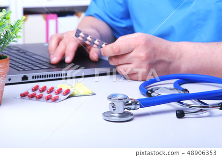 Doctor hand showing drug boxes at Office Desktop. Health care, Medical and Pharmacy Concept. Doctor hand showing drug boxes at Office Desktop. Health care, Medical and Pharmacy Concept. 48906353