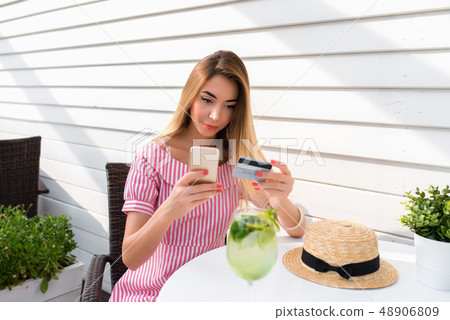 Beautiful girl hands plastic credit card, smartphone. Online application online banking, pay for Beautiful girl hands plastic credit card, smartphone. Online application online banking, pay for 48906809