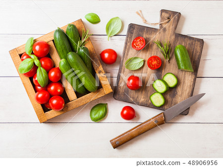 Organic Tomatoes and cucumbers with basil and 48906956