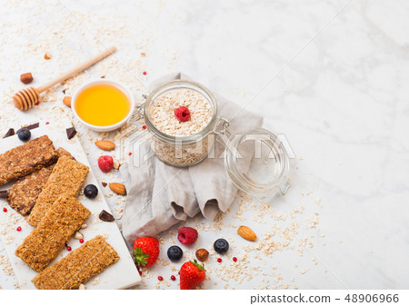 Organic cereal granola bar with berries on marble 48906966