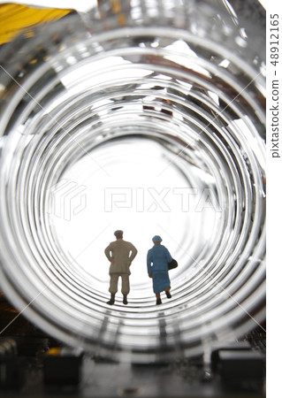 People passing through transparent plastic and tunnel in the future society People passing through transparent plastic and tunnel in the future society 48912165