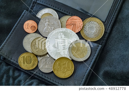 Bitcoin, national and euro coins on black leather wallet. 48912778