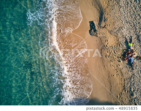 Beautiful beach with family top view shot 48915835