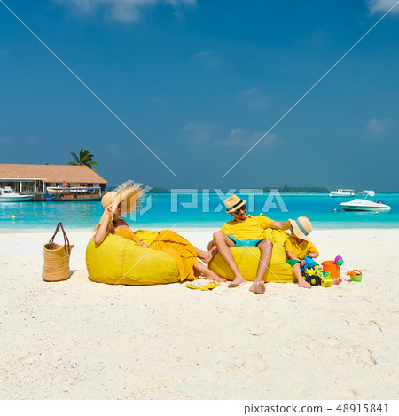 Family with three year old boy on beach Family with three year old boy on beach 48915841