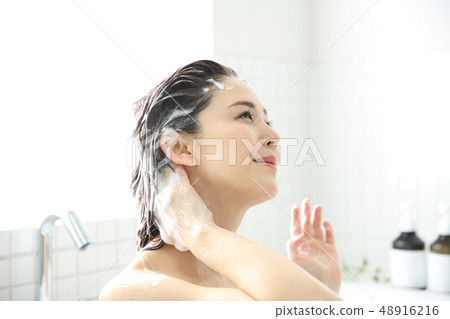woman washing hair woman washing hair 48916216