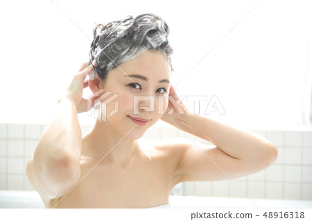 woman washing hair woman washing hair 48916318
