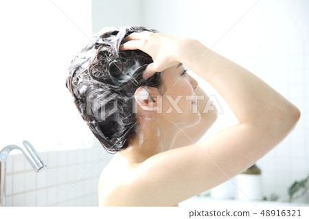 woman washing hair woman washing hair 48916321