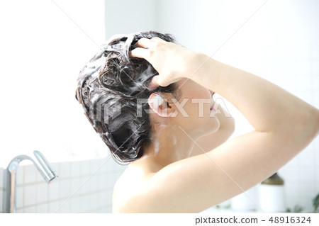 woman washing hair woman washing hair 48916324