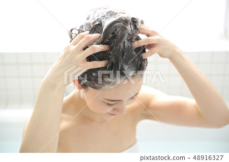 woman washing hair woman washing hair 48916327