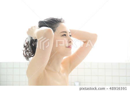 woman washing hair woman washing hair 48916391