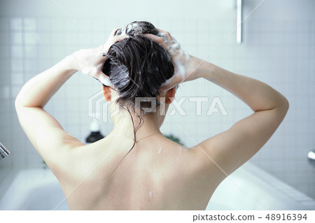 woman washing hair woman washing hair 48916394