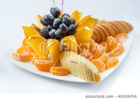 Mixed fruit in white plate isolated on white background - Healthy food style Mixed fruit in white plate isolated on white background - Healthy food style 48916458