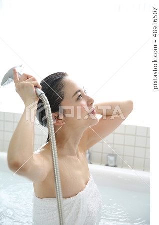 Woman taking a shower 48916507