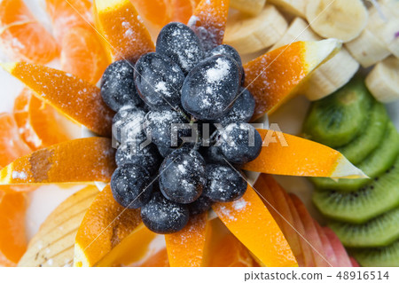 Mixed fruit in white plate isolated on white background - Healthy food style 48916514