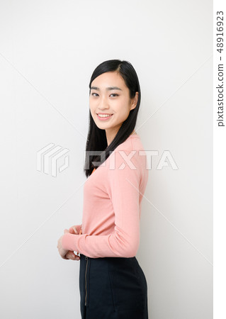 Plain background female model 48916923