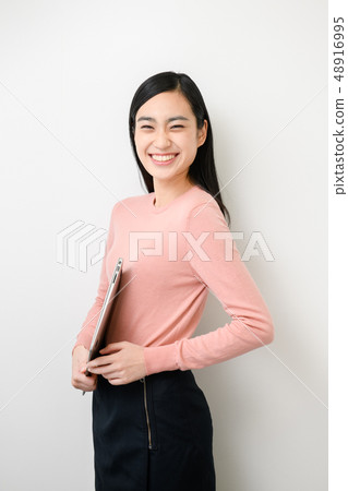 Plain background female model 48916995