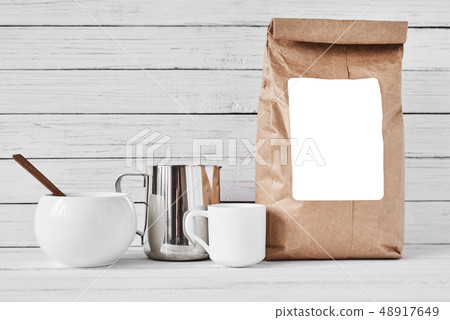 Coffee cup, craft paper bag and stainless pitcher Coffee cup, craft paper bag and stainless pitcher 48917649