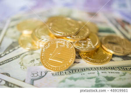 Business concept of crypto currency. Golden Lightcoin on us dollars close up. 48919981