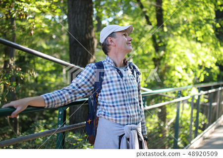 Mature man in summer park Mature man in summer park 48920509