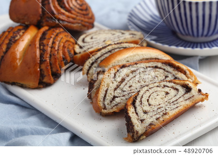 Poppy seed rolls and green tea 48920706