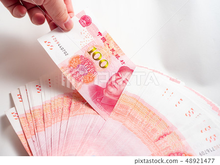 Hand holding Chinese yuan banknotes Hand holding Chinese yuan banknotes 48921477