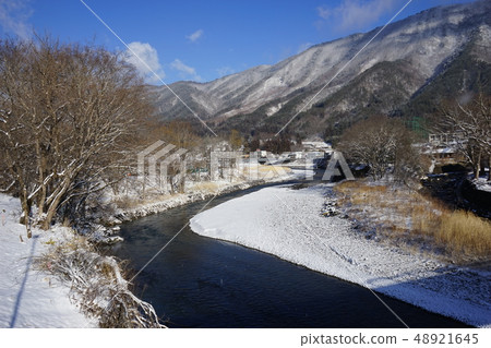 Mount Uinrasan of fresh snow towering just above Ryusen-dong 48921645