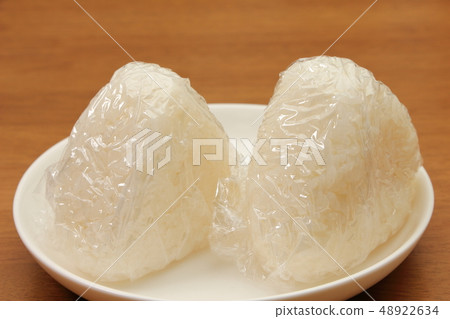 Rice balls grasped using lap due to sanitary considerations. Rice balls grasped using lap due to sanitary considerations. 48922634