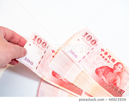 Hand holding taiwan dollars 48923939