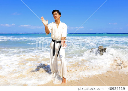 Men training on a beautiful tropical country beach Men training on a beautiful tropical country beach 48924319