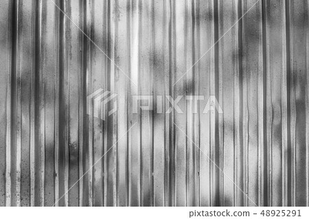 Wall made of gray metal sheet. Zinc-like Used as a 48925291