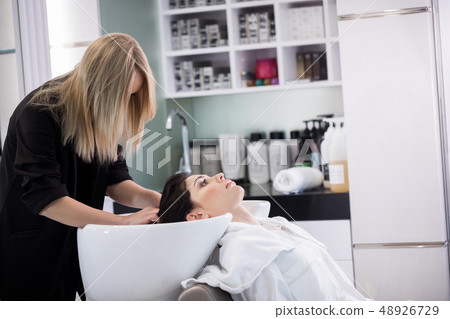 Stylist is working with client in barbershop Stylist is working with client in barbershop 48926729