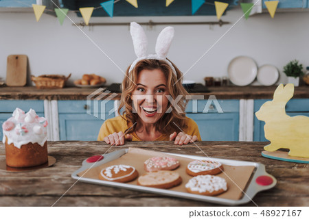 Happy young woman look out from table 48927167