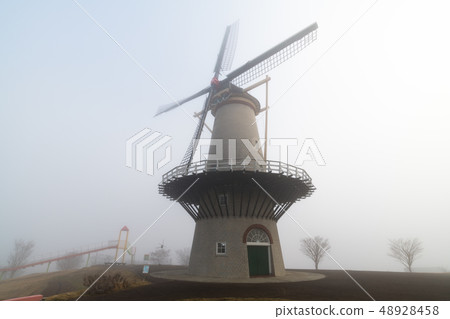 Miyagi Naganuma Futopia Park Dutch windmill in the morning mist 48928458